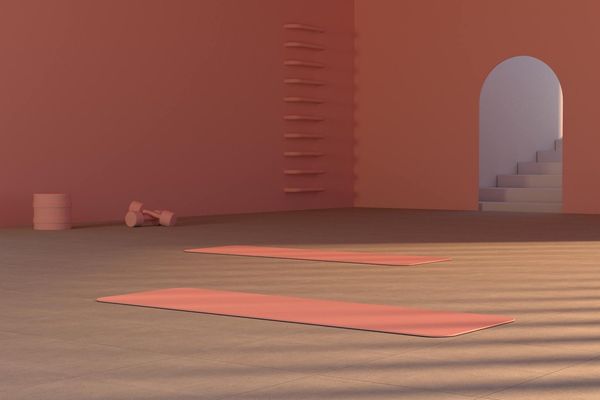 Yoga equipment arranged neatly on a light wooden floor